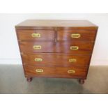 A mahogany two part campaign type chest with two short over three long drawers, turned feet, 102cm