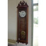 A walnut double weight Vienna wall clock - 121cm tall, running order