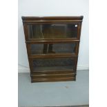 A Globe Wernicke oak three section stacking book case, 115cm tall x 87cm wide