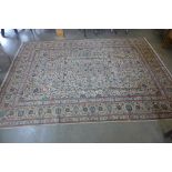 A hand knotted woollen Kshan rug, 352cm x 259cm - in generally good condition