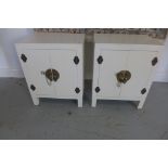 A pair of white oriental style bedside cupboards, 56cm tall x 45cm x 32cm