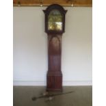A mahogany 8 day lang case clock, with a rocking ship movement, and a 12 inch brass dial, signed