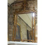 An ornate gilt mirror, 138cm x 78cm