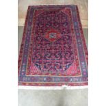 A hand knotted woollen Antique Malayer rug - 202cm x 132cm