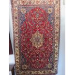 A hand knotted woollen Qum rug - 205cm x 140cm