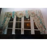 A pair of light green lined, with roses design and swags, 44 inch wide and 96 inch drop curtains