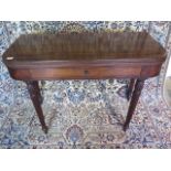 A Georgian mahogany tea table with a single drawer on reeded legs with its key, with a nice