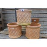 Three terracotta garden planters, 20cm high