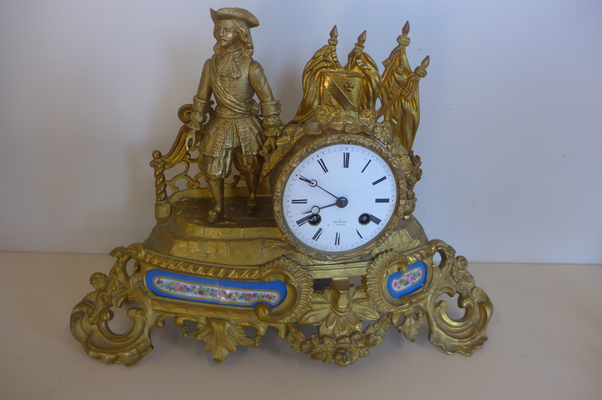 An ormulu and porcelain french figural mantle clock, Henry Mare Paris with silk suspension, 27cm