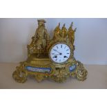 An ormulu and porcelain french figural mantle clock, Henry Mare Paris with silk suspension, 27cm