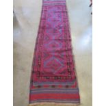 A hand knotted woollen Meshwani runner, approx 242cm x 61cm in good condition