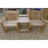 A wooden garden love seat