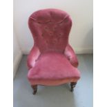 A Victorian button back fireside chair, 78cm tall