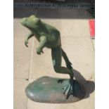 A cast iron green painted leaping frog figurine, approx 67cm high, repair to one arm