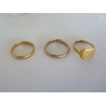 A 9ct gold band ring, approx 3 grams, and two 22ct gold rings, approx 6 grams