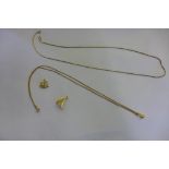 An 18ct gold chain, approx 4 grams, broken, two gilt metal charms and a gilt metal chain and