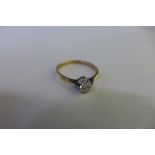 An 18ct gold solitaire ring, size K, approx 1.9 grams, approx 0.21ct, diamond bright, some usage
