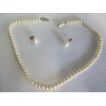 A single strand cultured pearl necklace with 9ct clasp, together with a pair of 9ct pearl set stud