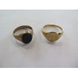 Two 9ct gold signet rings, one engraved - PWM - size X, the other inset with a hard stone, size T,