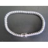 A platinum and diamond tennis bracelet with 53 diamonds, total weight 5.83ct, D and E colour, VVS to