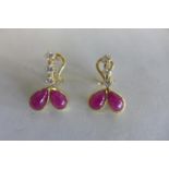 A pair of 18ct diamond and ruby earrings with Omega clips, approx 6 grams, in good condition