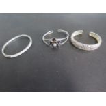 Three silver bangles, one with ornate pierced decoration, two stone set - approx 50 grams