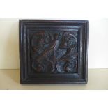 A naively carved oak panel, approx 18cm x 19.5cm