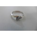 An 18ct white gold, diamond crossover, two stone, ring size O, approx 3.7 grams, diamonds bright -