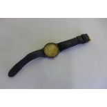 A 9ct Rotary Elite wristwatch on a leather strap not working, total weight approx 33 grams