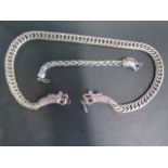 A white metal dragon head necklace, 65cm long, and a bracelet