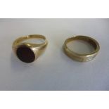 A 9ct gold diamond ring, size V, and a gents 9ct gold ring inset with a hard stone, size I,