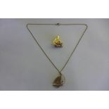 A 9ct yellow gold ship pendant on a 9ct chain and a ship brooch, approx total weight 9.7 grams,