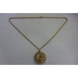 A 9ct yellow gold ship pendant and chain, approx 11 grams