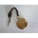 An 18ct yellow gold pocket watch, 4cm wide with gold dust cover, with key and running, generally