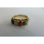 A 9ct gold five stone multi gem hard stone ring, size M, approx 2.5 grams - some usage marks, but