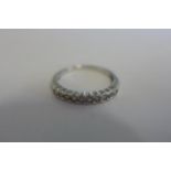 An 18ct white gold, ten stone diamond ring, approx total 0.25ct ,ring size L, approx 2 grams