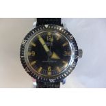 A Smiths military style gents wristwatch with black dial and rotating bezel, 38mm wide including