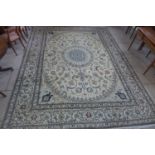 A hand knotted woollen Fine Nain silk inlaid rug - 400cm x 295cm - some small stains and wear,