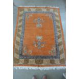 An oriental rug with an orange field, 210x150cm - some wear mainly to edges