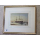 A watercolour of HMS Victory, signed WE Mitchell, dated 1918 - with battleship in background, in a