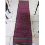 A hand knotted woollen Meshani runner - 241x60cm