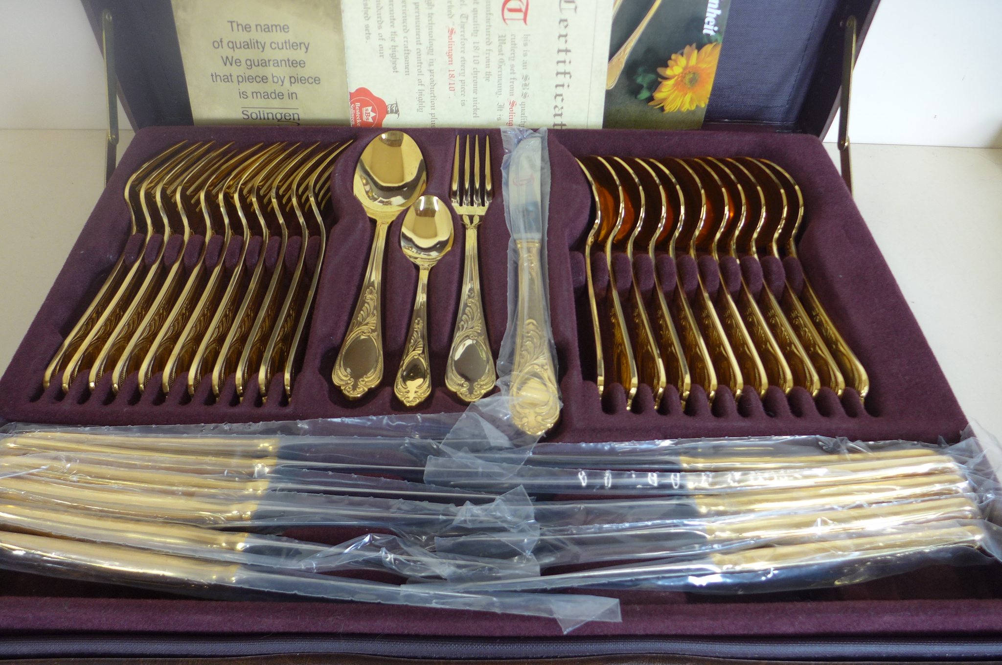 A SBS Bestecke Solingen gold plated twelve setting canteen of cutlery in fitted case, in unused - Image 2 of 3