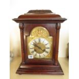 An 8 day mahogany mantle clock with brass and silvered dial, strikes hour/half on a rod - 40cm tall