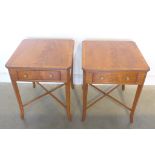 A pair of fruit wood veneered lamp tables, with a single drawer, on splayed legs, united by cross