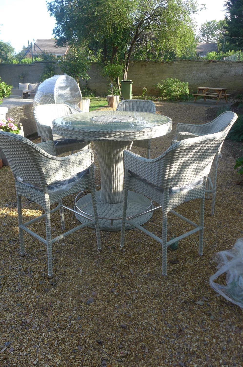 A Bramblecrest Monterey 120cm round bar table with five bar chairs, ex-display