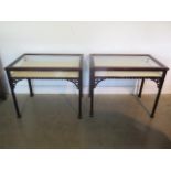 A matched pair of mahogany bijouterie display tables with lift up tops, 71cm tall x 86cm wide x 54cm