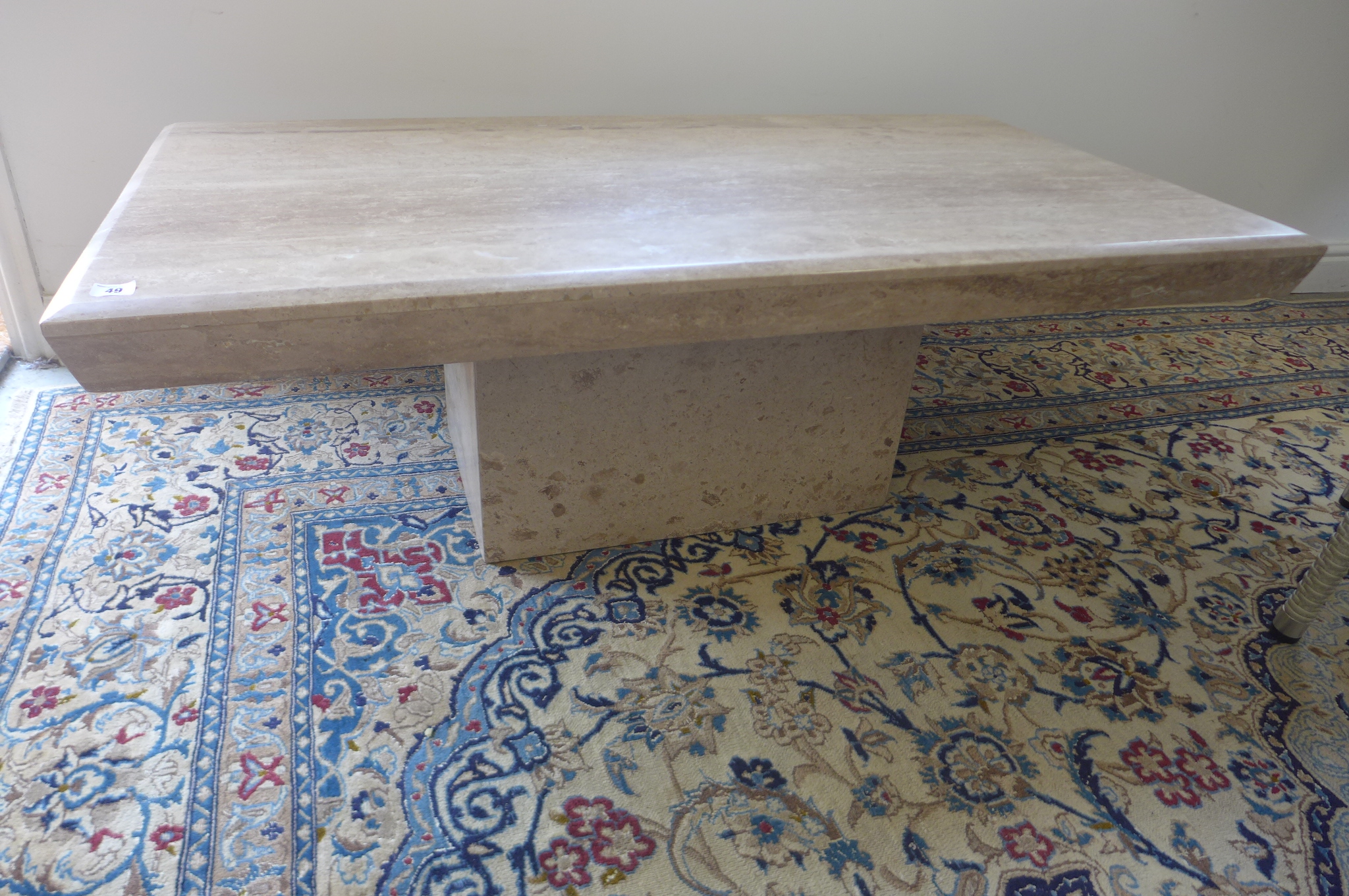 A Travertine coffee table, base and top, 42cm tall, 70x130cm