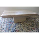 A Travertine coffee table, base and top, 42cm tall, 70x130cm