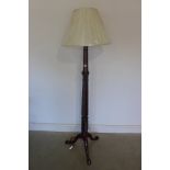 A Georgian mahogany standard lamp with turned and reeded column in restored condition and complete