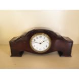 An 8 day mahogany case mantle clock, with platform movement, 14cm tall, in good working order